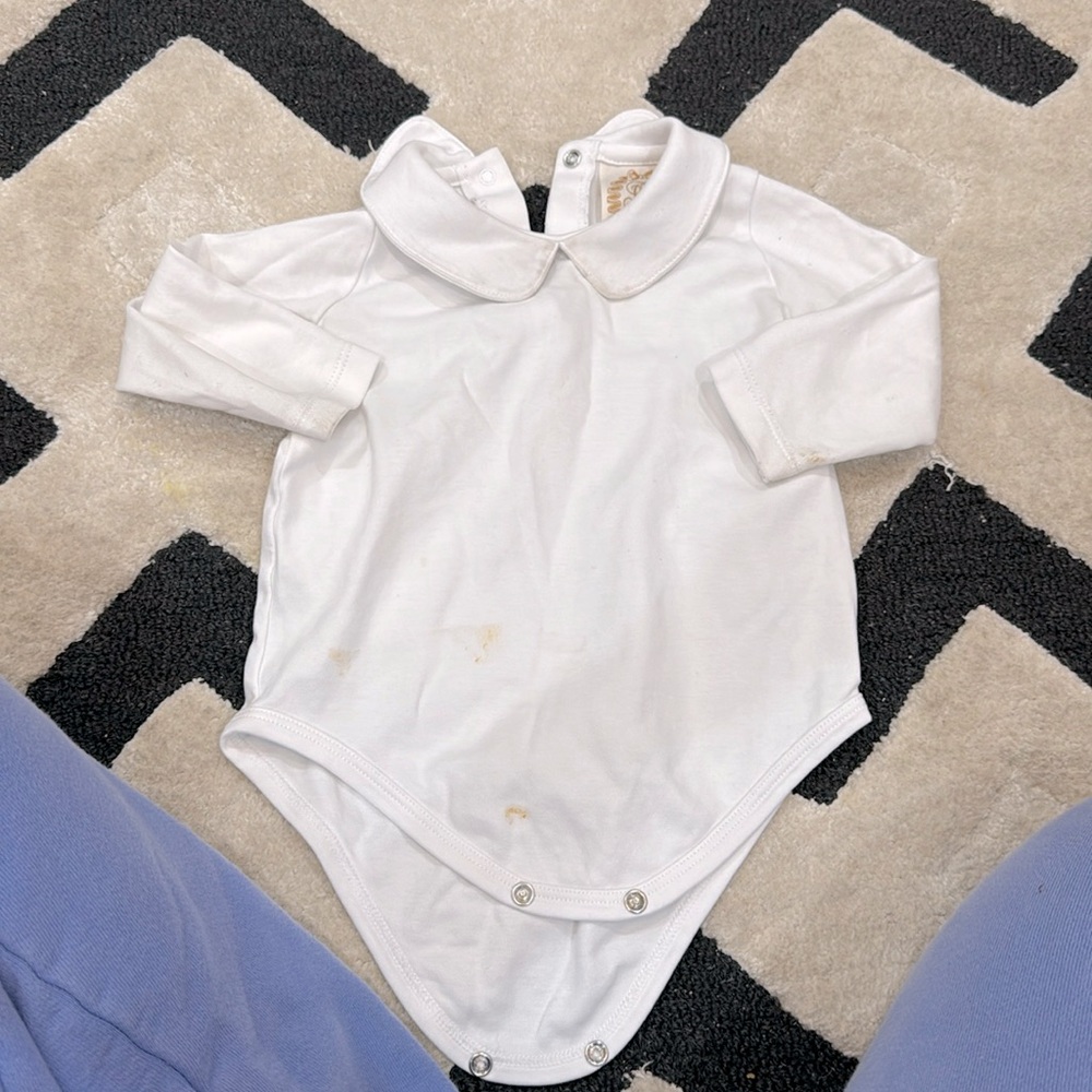 The Beaufort Bonnet company peterpan collared long sleeve onesie.